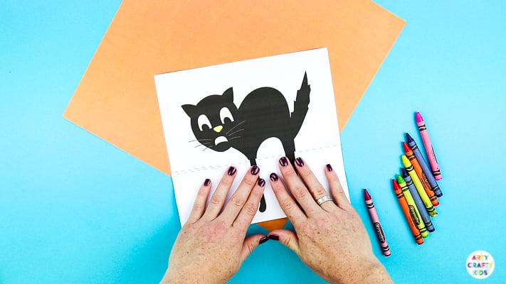 Arty Crafty Kids | Surprise Black Cat Printable Craft  - A fun Halloween craft for kids. Unfold the paper toy to reveal and an eight legged surprise!