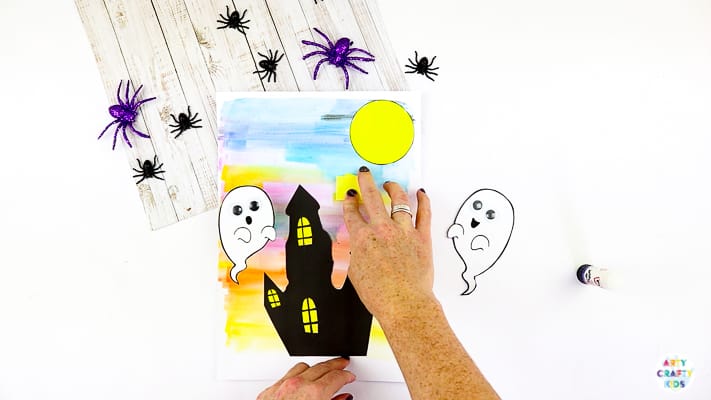 Arty Crafty Kids | Easy Bobble Ghost Halloween Craft for Kids. These playful ghosts will bounce and bobble above their haunted house, creating a fun and engaging paper craft kids will love!