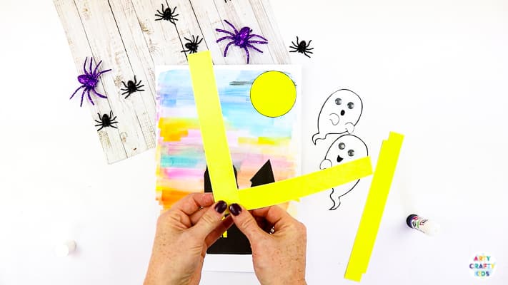 Arty Crafty Kids | Easy Bobble Ghost Halloween Craft for Kids. These playful ghosts will bounce and bobble above their haunted house, creating a fun and engaging paper craft kids will love!