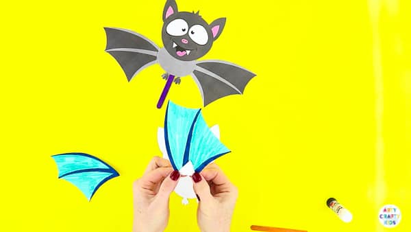 Halloween Crafts for Kids | Glue the wings to the paper toy bat.