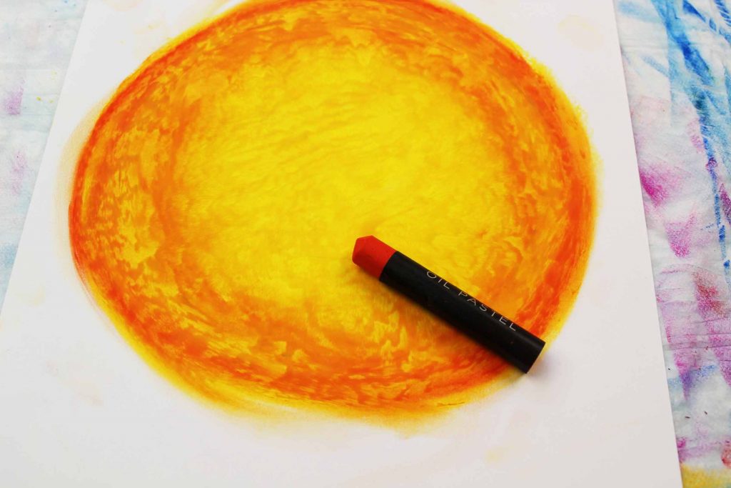 Arty Crafty Kids | Create a moon with yellow and orange oil pastels.