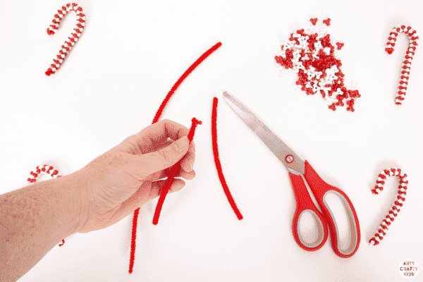 Make Beaded Candy Cane Ornaments with the kids this Christmas. Made with just two materials, kids will love this  simple and fun Christmas craft.