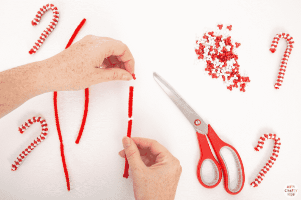 Make Beaded Candy Cane Ornaments with the kids this Christmas. Made with just two materials, kids will love this  simple and fun Christmas craft.