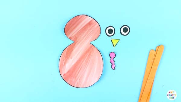 Arty Crafty Kids | Using a printable turkey template to create a turkey puppet.