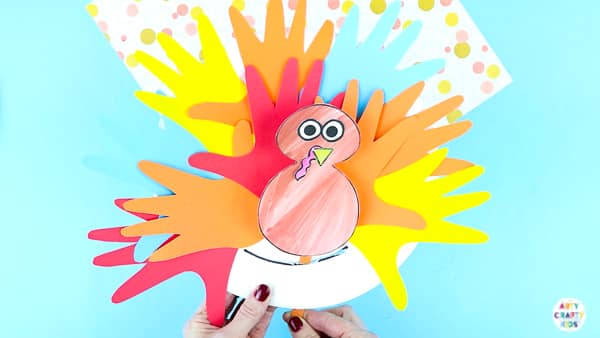 Arty Crafty Kids | Paper Plate Handprint Turkey Craft for Kids | Keep the kids entertained this Thanksgiving and fall with this super cute Paper Plate Handprint Turkey Craft.