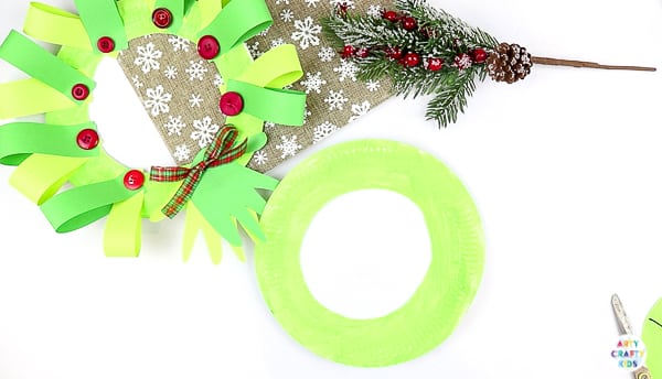 Arty Crafty Kids | Easy Paper Plate Handprint Christmas Wreath for Kids to make.