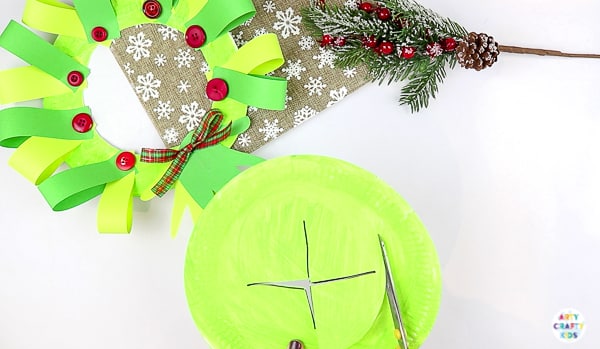 Arty Crafty Kids | Easy Paper Plate Handprint Christmas Wreath for Kids to make.