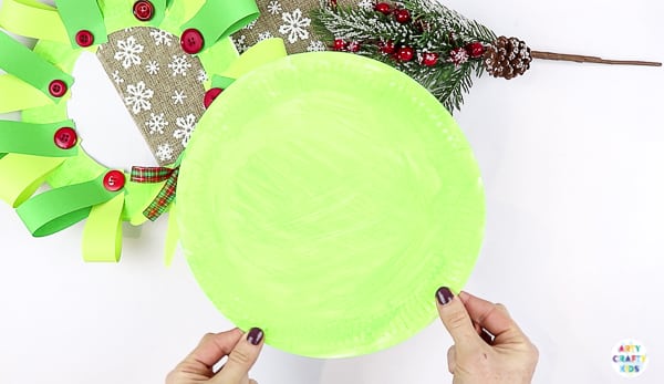 Arty Crafty Kids | Easy Paper Plate Handprint Christmas Wreath for Kids to make.