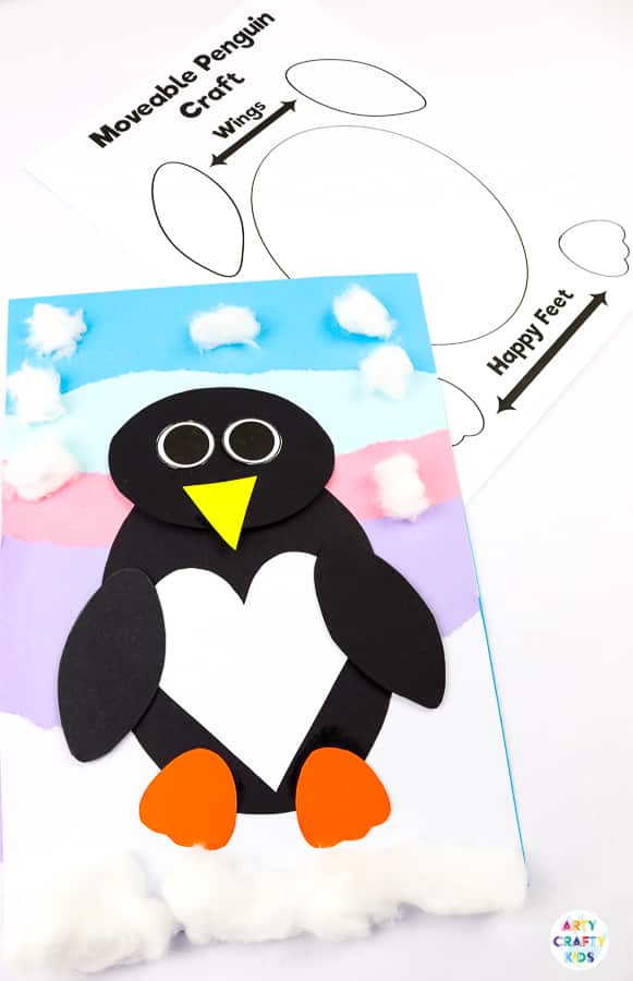 Interactive Paper Penguin Craft - Inspired by Happy Feet. A fun and engaging Winter craft for Kids. With a penguin that moves and dances on the snowy floor, this is a craft that inspires children to play! This craft can be completed with our Printable Penguin Template.