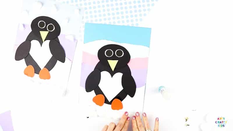 Interactive Paper Penguin Craft - Inspired by Happy Feet. A fun and engaging Winter craft for Kids. With a penguin that moves and dances on the snowy floor, this is a craft that inspires children to play!