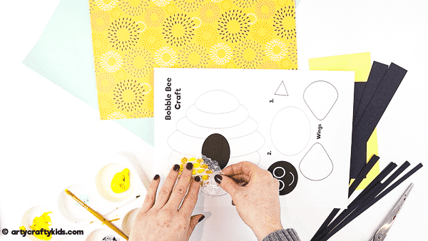 Bobble Bee Paper Craft for Kids | An engaging, fun and easy Spring Craft that kids will love! Use our printable templates to create a bee that buzzes and bounces around its beehive.