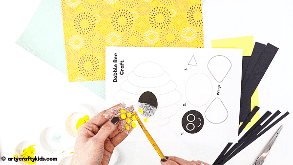 Bobble Bee Paper Craft for Kids | An engaging, fun and easy Spring Craft that kids will love! Use our printable templates to create a bee that buzzes and bounces around its beehive.