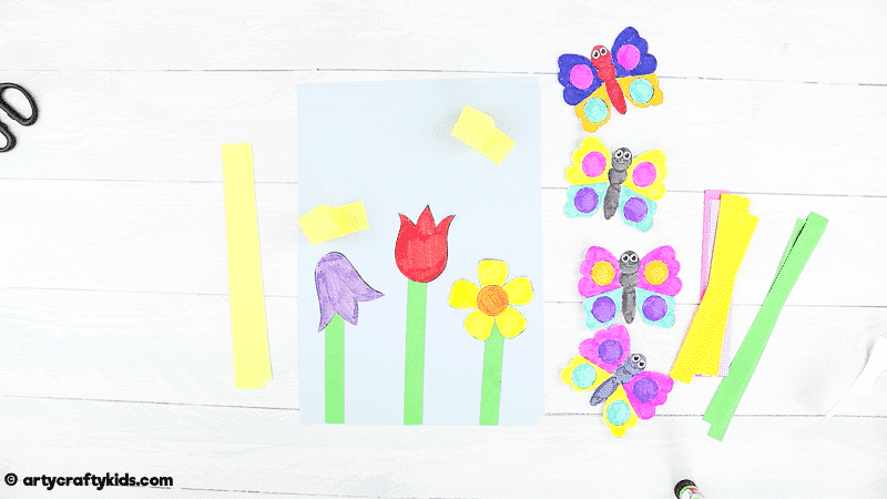 Make a Bobble Butterfly Craft with Spring Flowers with the Kids.  A fun and easy Spring craft that kids will love. The butterfly craft can be completed with our printable butterfly template.