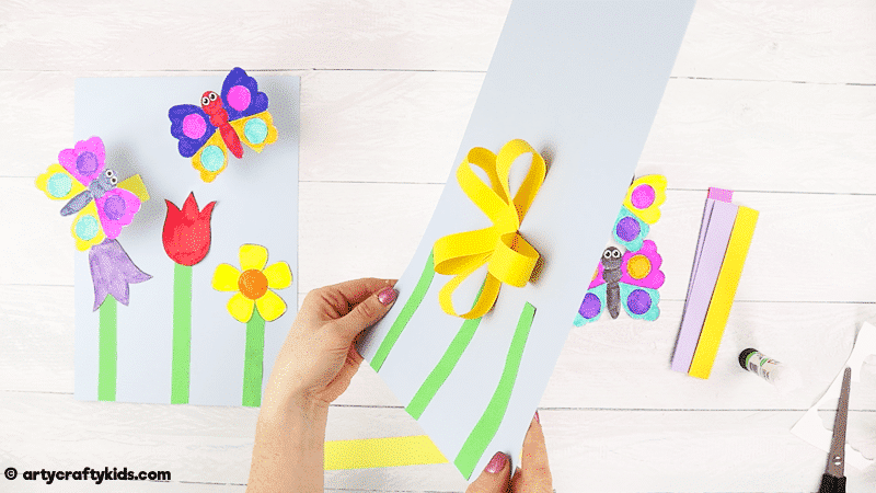 Make a Bobble Butterfly Craft with Spring Flowers with the Kids.  A fun and easy Spring craft that kids will love. The butterfly craft can be completed with our printable butterfly template.