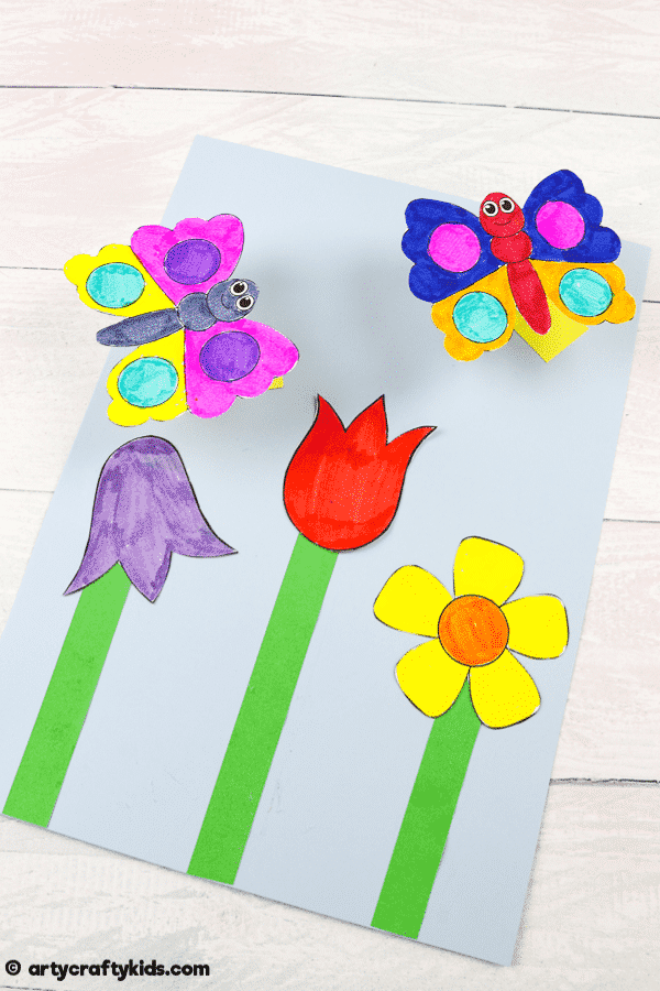 Make a Bobble Butterfly Craft with Spring Flowers with the Kids.  A fun and easy Spring craft that kids will love. The butterfly craft can be completed with our printable butterfly template.