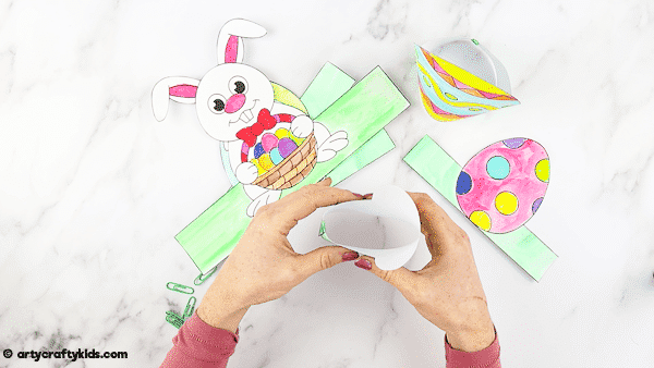 Printable Easter Paper Toy for kids to color and assemble. A combined activity of craft and play; children can use the toys within an Easter egg hunt, maths games and Easter imaginative play.