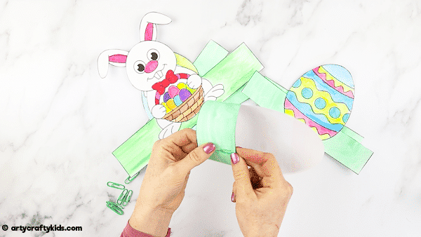 Printable Easter Paper Toy for kids to color and assemble. A combined activity of craft and play; children can use the toys within an Easter egg hunt, maths games and Easter imaginative play.