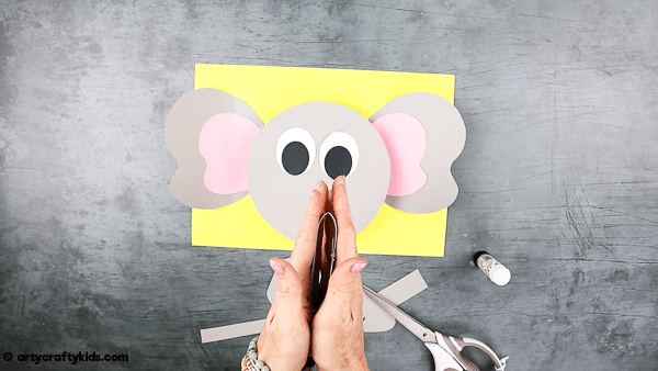 3D Paper Elephant Craft: Create a large paper loop for the nose.