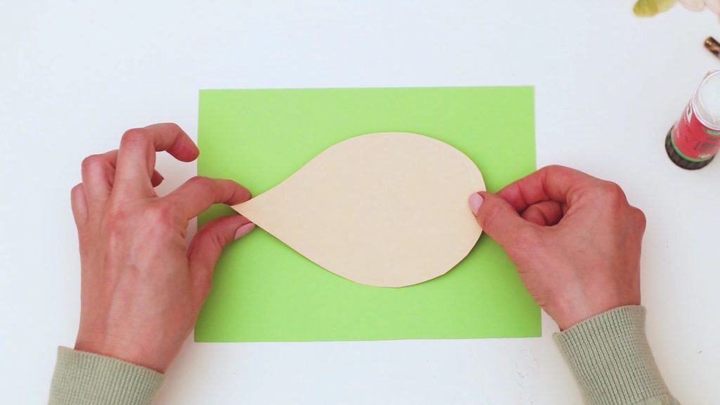 Secure the shape to a piece of green backing card.