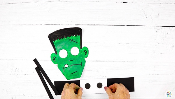 Cut out the Frankenstein elements from the template. Create three paper strips