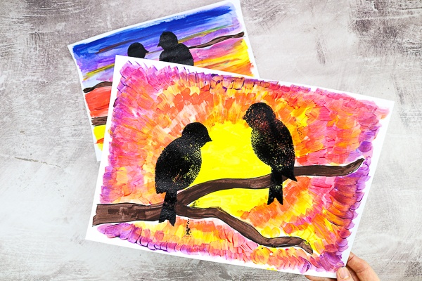 Explore natures daily wonder with this beautiful and easy bird silhouette art project for kids - Children are encouraged to pay attention to how the sunset's colors change, and to play with the paint as they blend the colors together and create depth and pattern in the sky.