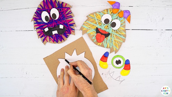 Trace the monster body onto a piece of scrap cardboard.