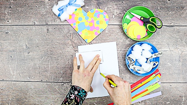 Align the template along the edge of the folded card. Trace the stocking with a pencil.