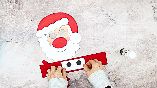 Moving Santa Craft for Kids: This easy Christmas craft is easy enough to be enjoyed independently, with only simple cutting and painting, and the interactive element brings an extra dimension of play, meaning it's ideal for pre-schoolers and school early years.