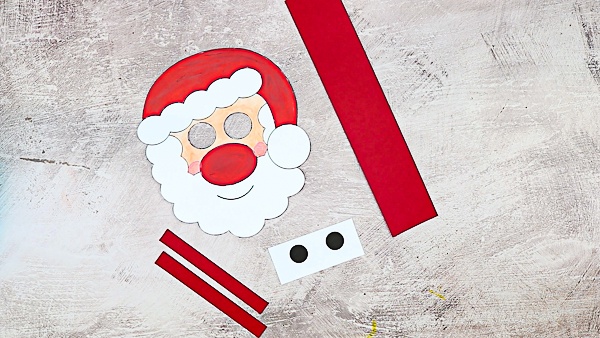 Moving Santa Craft for Kids: This easy Christmas craft is easy enough to be enjoyed independently, with only simple cutting and painting, and the interactive element brings an extra dimension of play, meaning it's ideal for pre-schoolers and school early years.