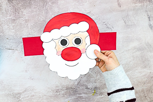 Moving Santa Craft for Kids: This easy Christmas craft is easy enough to be enjoyed independently, with only simple cutting and painting, and the interactive element brings an extra dimension of play, meaning it's ideal for pre-schoolers and school early years.