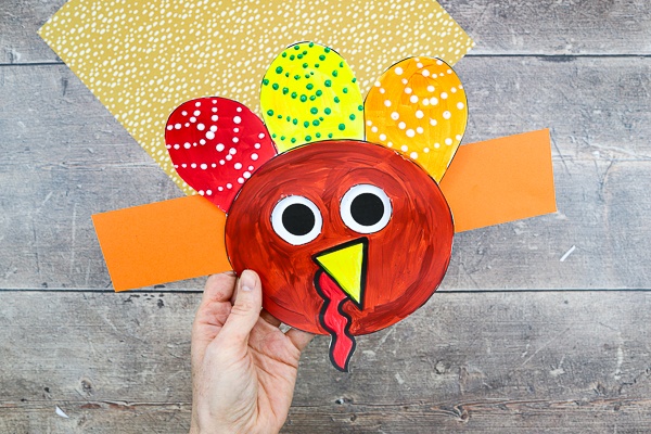 Get your Thanksgiving craft on with this adorable Moving Eyes Turkey Craft for kids! 

Children can practice their fine motor skills with cutting and sticking, and use their imaginations to explore color and texture with paints. And as the finished craft is so tactile and interactive, kids will have a great time playing with their creation afterwards, too.