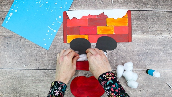 Assemble Santa's boots and line the top of the boot with fuzzy cotton wool.