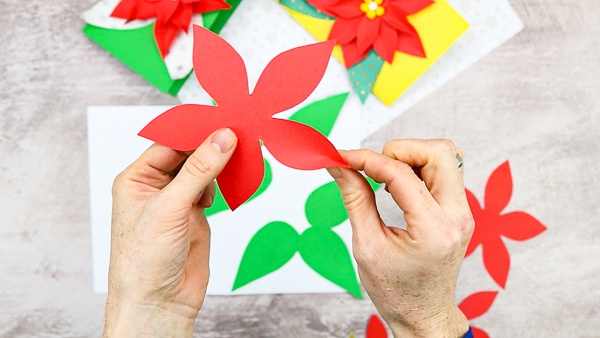 To create a 3D effect, pinch the tips of petals to create a central crease.