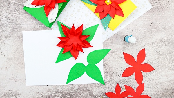 Add a third and final layer of poinsettia petals.