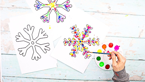 Raised Salt Painted Rainbow Snowflakes: Part art, part experiment, this easy Winter craft is a fun and engaging way to combine art and science.