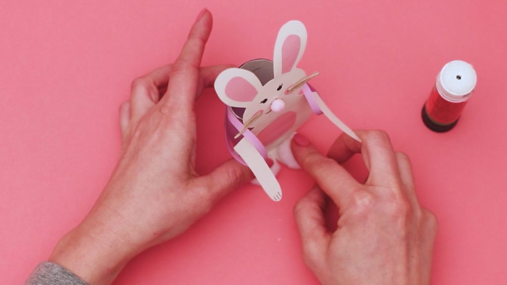 Add a pair of pom-pom's to the bunny's feet.