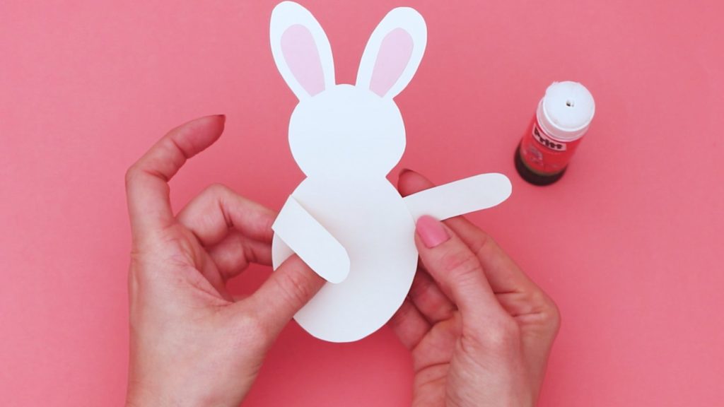 Assemble the bunny. Either draw the shapes or cut out the elements from the Easter Bunny template.