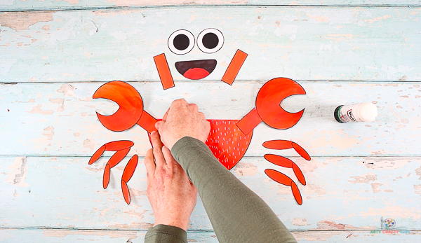 Assemble the crabs claws and affix to the body.