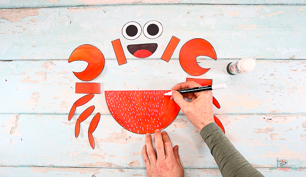 Add decorative detail to the crabs body using a contrasting color.