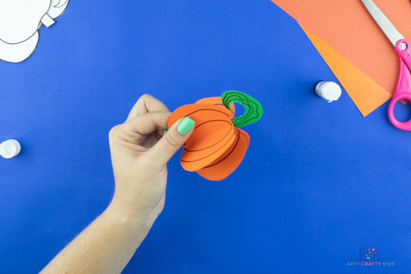 Image showing a completed pumpkin bauble and completion of the paper pumpkin craft tutorial.