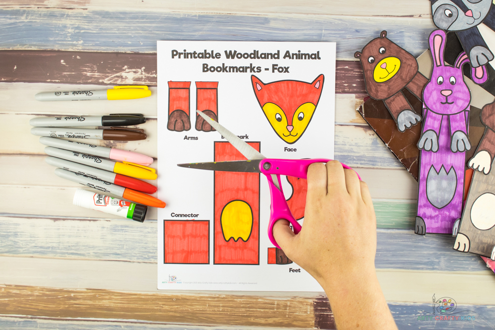 Image shows scissors over the Printable Woodland Animal template, ready to be cut out.