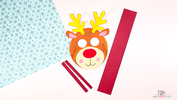 Image showing an assembled reindeer head with 3 paper strips. One long and wide, two others short and thin.