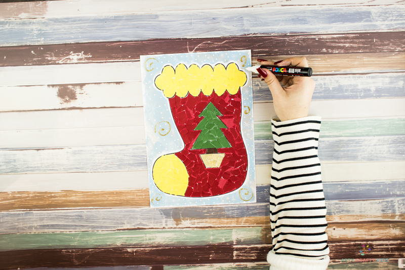 Add a wintery background to the completed Paper Christmas Stocking Collage