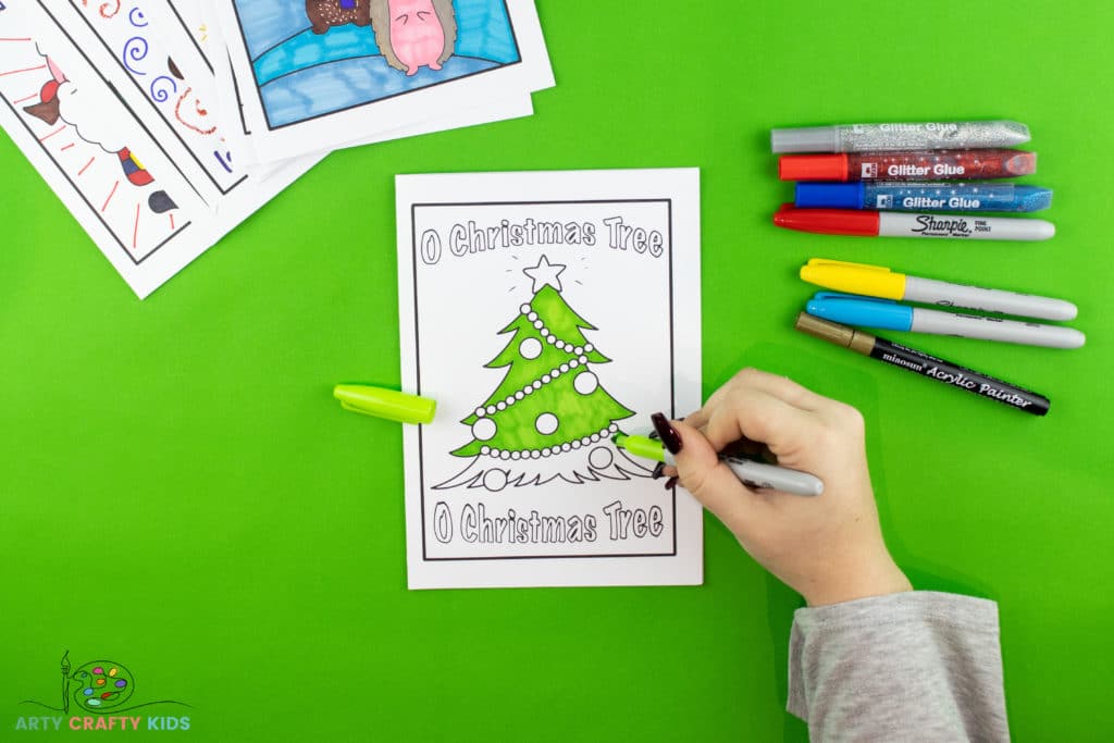 Image showing the printable christmas card bring colored in with felt tip pens.