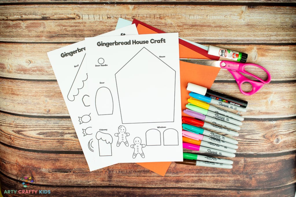 Image showing Gingerbread House Paper Craft Templates, colored card stock, scissors, glue stick and colored felt tip pens.