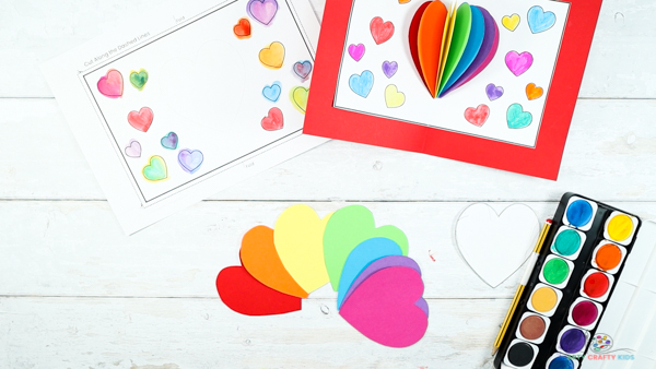 Image showing 7 heart cut outs in the rainbow colors.