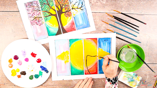 Image showing hands painting the trunch and first branch of the tree.