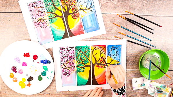 Four Seasons Tree Painting: Image showing hands painting dots into the Autumn segment of the tree.