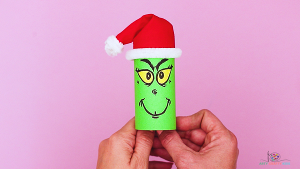 Get into the Christmas spirit by making the most mischievous of Christmas characters - the Grinch! This paper roll grinch craft is super fun and easy for kids to make.