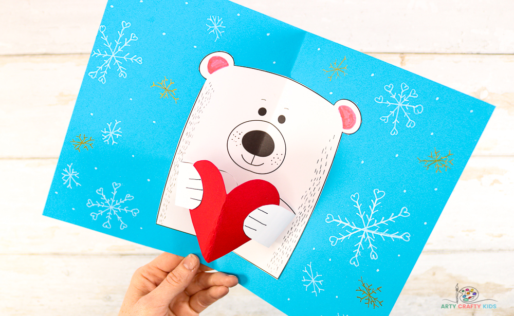 This adorable polar bear card idea with a pop up heart is the perfect craft for celebrating Valentine's Day, Mother's Day, Father's Day and every other special day in the calendar. 

It's a universal card making craft that's easy and fun for kids to make; fitting in perfectly with Winter themed polar bear crafts (that are often very popular with children) and arctic topic.